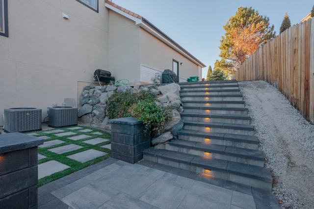 Trimmed shrubs and a tidy planted border alongside a Reno home